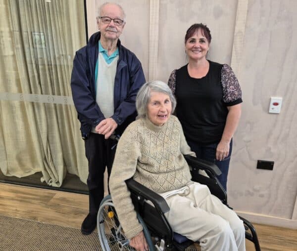 Judith (seated in a wheelchair) And Allen With Cat Taylor