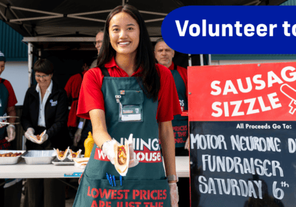 Bunnings staff working at a sausage sizzle to raise money