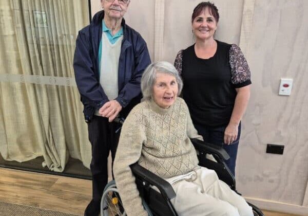 Judith (seated in a wheelchair) And Allen With Cat Taylor