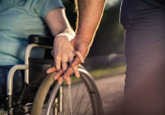 Close Up Holding Hand To Invalid Person