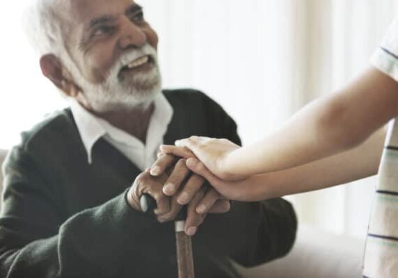 Grandson Holding Grandpa's Hands